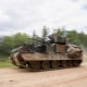 A U.S. Army M2/M3 Bradley infantry fighting vehicle drives along a road during a multinational exercise at Hohenfels Training Area in Germany on June 8, 2022.