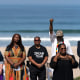 FILE - Anthony Bruce, from left, a great-great grandson of Charles and Willa Bruce; wife, Sandra; Kavon Ward, founder of Justice for Bruce's Beach; Derrick Bruce, great grandson of Charles and Willa Bruce; Chief Duane Yellow Feather Shepard and Mitch Ward attend a dedication ceremony in Manhattan Beach, Calif., Wednesday, July 20, 2022. Southern California beachfront property that was taken from Willa and Charles Bruce, a black couple, through eminent domain a century ago and returned to their heirs in 2022 will be sold back to Los Angeles County for nearly $20 million. The decision to sell what was once known as Bruce's Beach was announced Tuesday, Jan. 3, 2023, by local and state officials who led governmental efforts to undo the long-ago injustice. (AP Photo/Jae C. Hong,File)
