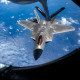 A 199th Fighter Squadron F-22A Raptor approaches a 909th Air Refueling Squadron KC-135 Stratotanker over the East China Sea June 8, 2022. The 199th FS conducted agile combat employment operation in the Pacific to strengthen the readiness and interoperability needed to defend Japan and ensure a free and open Indo-Pacific. (U.S. Air Force photo by Senior Airman Stephen Pulter)