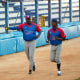 Batting coach Pedro Luis Lazo, left, and pitcher Livan Moinelo warm up as Cuban national baseball team hopefuls begin training for the 2023 World Baseball Classic