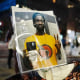 A photograph of Tyre Nichols is displayed during a rally against the fatal police assault of Tyre Nichols.