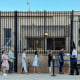 Cubans queue to enter the US embassy in Havana after full immigrant visa services for Cubans resumed