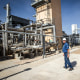 A plant operator at the Federal Helium Reserve walks through the Federal Crude Helium Enrichment Unit near Amarillo, Texas, on July 6, 2011.