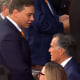 From left, Rep. George Santos, R-N.Y., speaks with Sen. Mitt Romney, R-Utah, before the start of the State of the Union address at the U.S. Capitol, on Tuesday.