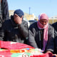 Image: Syrian men mourn as they identify a body of a relative killed in the earthquake after its arrival at the Bab al-Hawa border crossing near Syria and Turkey on Feb. 8, 2023.