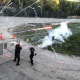 Protesters throw bricks at the site of police training center under construction in Atlanta on March 5, 2023.