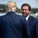 President Donald Trump is greeted by Florida Governor Ron DeSantis at Southwest Florida International Airport Oct. 16, 2020, in Fort Myers, Fla.