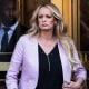 NEW YORK, NY - APRIL 16: Adult film actress Stormy Daniels (Stephanie Clifford) exits the United States District Court Southern District of New York for a hearing related to Michael Cohen, President Trump's longtime personal attorney and confidante, April 16, 2018 in New York City. Cohen and lawyers representing President Trump are asking the court to block Justice Department officials from reading documents and materials related to Cohen's relationship with President Trump that they believe should be protected by attorney-client privilege. Officials with the FBI, armed with a search warrant, raided Cohen's office and two private residences last week.