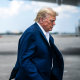 Former President Donald Trump boards his airplane, known as Trump Force One, in route to Iowa at Palm Beach International Airport on Monday, March 13, 2023, in West Palm Beach, Fla.