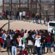 Migrants are processed by United States border patrol agents at the US-Mexico border in Ciudad Juarez, Mexico