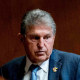 Sen. Joe Manchin, D-W.Va., arrives for a Senate hearing on March 28, 2023.