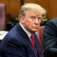 Image: Former President Donald Trump sits at the defense table with his defense team in a Manhattan court during his arraignment on April 4, 2023, in New York.