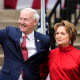 Image: Former Arkansas Gov. Asa Hutchinson, left, waves after his wife, Susan, introduced him to formally announce his Republican campaign for president, on April 26, 2023, in Bentonville, Ark. 
