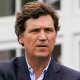 Tucker Carlson attends the final round of the Bedminster Invitational LIV Golf tournament in Bedminster, N.J., on July 31, 2022.