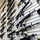 A selection of AR-15-style rifles hangs on a wall at R-Guns store on Jan. 11, 2023, in Carpentersville, Ill.