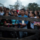 Image: Migrants who plan to start walking across the Darien Gap from Colombia to Panama in hopes of reaching the U.S. gather at the trailhead camp in Acandi, Colombia, on May 9, 2023. 