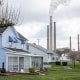 Homes stand in front of a power plant in Conesville, Ohio, in 2020. 