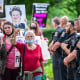 Police officers look on as abortion-rights advocates hold a demonstration outside the home of Supreme Court Justice Brett Kavanaugh on May 18, 2022, in Chevy Chase, Md.