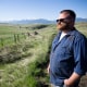 Garrett Mahon, a supporter of the Greater Idaho Movement, looks out over land in the direction of the Idaho border, near his 600-plus acre timber property in Wallowa, Oregon, on May 13, 2023. 