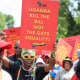 Members of the Economic Freedom Fighters picket against Uganda's anti-gay bill at the Uganda High Commission in Pretoria, South Africa