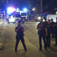Police officers respond to a shooting at a July 4th celebration in Dallas Fort-Worth late on Monday.