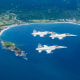 Pilots from the 7th Wing Air Base in Taitung practice their skills during a daily training flight near the eastern coast of Taiwan.