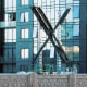 A partially completed "X" sign rests atop the company headquarters, formerly known as Twitter, in downtown San Francisco, on Friday, July 28, 2023. San Francisco has launched an investigation into the sign as city officials say replacing letters or symbols on buildings, or erecting a sign on top of one, requires a permit. (AP Photo/Noah Berger)
