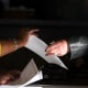 RIDGELAND, MS - NOVEMBER 27: A poll worker hands a ballot to a voter at a polling place at Highland Colony Baptist Church, November 27, 2018 in Ridgeland, Mississippi. Voters in Mississippi head to the polls for today's special runoff election, where  Democratic candidate for U.S. Senate Mike Espy is running in a close race with appointed Republican Senator Cindy Hyde-Smith (R-MS).