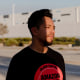 Daniel Rivera poses for a portrait in front of the Amazon warehouse where he works in Highland, Calif.