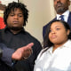 Attorney Roderick Edmond, left, speaks alongside Treveon Isaiah Taylor, Sr., center, Jessica Ross and attorney Cory Lynch, in Atlanta on Aug. 9, 2023.