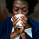 A woman with a cup of coffee