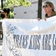 Heather Redding, left, and Elizabeth Waugh, of Orange County, North Carolina, rally for transgender rights outside the state Legislative Building in Raleigh, N.C., Wednesday, Aug. 16, 2023. North Carolina Republicans will attempt Wednesday to override the Democratic governor's veto of legislation banning gender-affirming health care for minors.