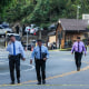 Image: Detectives walk at the scene of a mass shooting at Cook's Corner, on Aug. 24, 2023, in Trabuco Canyon, Calif.