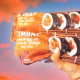 Hand holding Trader Joe's Kimbap against sky background