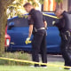 Police officers investigate the scene in Romeoville, Ill., on Sept. 18, 2023.