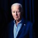 President Joe Biden waits to walk on stage during a virtual event with the National Education Association at the White House