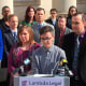 Connor Thonen-Fleck addresses reporters while his parents stand by his side on March 11, 2019, in Durham, N.C., at the announcement of a lawsuit against North Carolina officials over how the state health plan is run. 