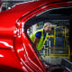 Plant Manager Susan Elkington looks over a Camry vehicle on an assembly line at the Toyota Motor Corp. manufacturing plant in Georgetown, Ky., on Aug. 29, 2019.