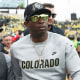 Deion Sanders exits the field following a football game 
