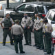 Police officers stand outside St. Francis Medical Center, after two Los Angeles County Sheriff's deputies were shot, in Lynwood, Calif., on Sept. 14, 2020.