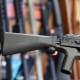 A bump stock device is installed on a AK-47 semi-automatic rifle, at a gun store in Salt Lake City