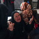 People mourn the dead in Rafah, Gaza.