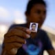 Image: Maria del Rosario Saravia Delgado holds a photo of her missing four-year-old son, Luis Alberto Lopez, in Acapulco on Nov. 1. Luis, as well as several other family members, have been missing since Hurricane Otis devastated the area.