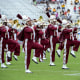Alabama A&M marching band members play on a field.