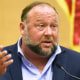 Alex Jones speaks on the witness stand at his Sandy Hook defamation damages trial