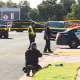 Emergency personnel work at the scene of a shooting
