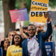 Demonstrators march from the Supreme Court to the White House after the court stuck down President Biden's student debt relief program on June 30, 2023.