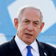 Benjamin Netanyahu in front of Israel flag. 
