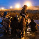 Migrants try to cross the Rio Grande River to the United States border