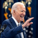President Joe Biden  waves as he  speaks on his economic plan for the country in Raleigh
